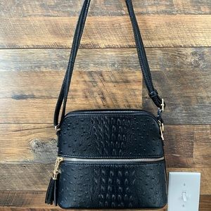 Black purse with adjustable shoulder strap